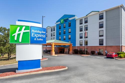 a sign for a holiday inn express and suites at Holiday Inn Express Hotel & Suites Charleston-Southridge by IHG in Charleston