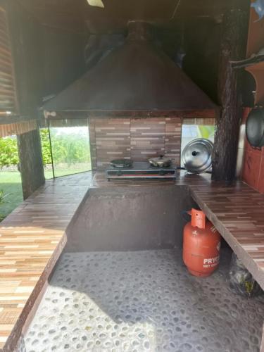 an outdoor kitchen with a stove and a pot at CASA MIA INN in Dauis