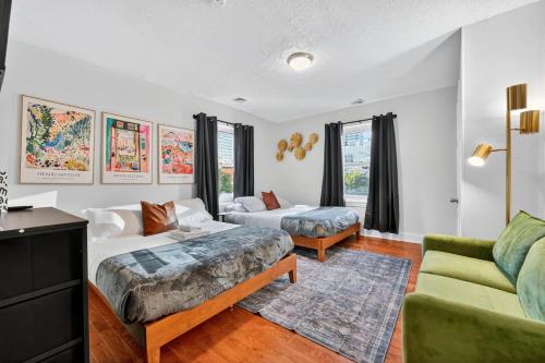 a living room with two beds and a couch at Large Studio in Center City that Sleeps 4 with Fast Wifi in Philadelphia