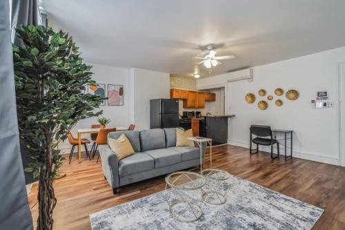 a living room with a couch and a table at Large Historical 1BR Center City that Sleeps 4 in Philadelphia