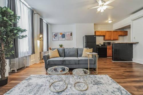 a living room with a couch and two tables at Large Historical 1BR Center City that Sleeps 4 in Philadelphia