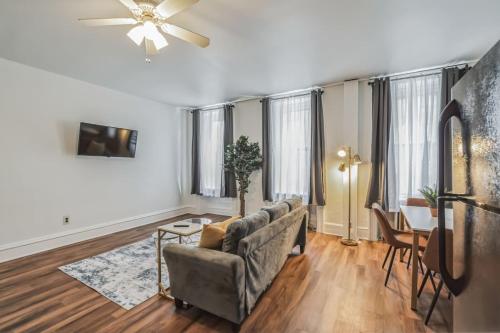 a living room with a couch and a table at Large Historical 1BR Center City that Sleeps 4 in Philadelphia