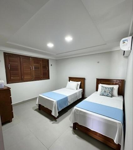 เตียงในห้องที่ Beach House 727