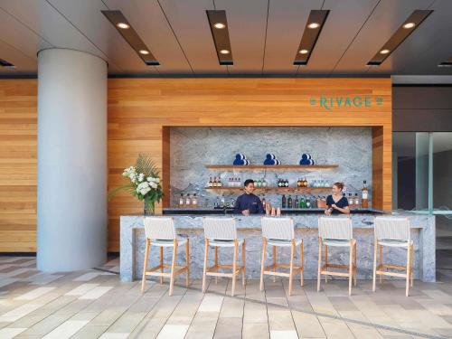 a bar in the lobby of a hotel at Sofitel Sydney Darling Harbour in Sydney