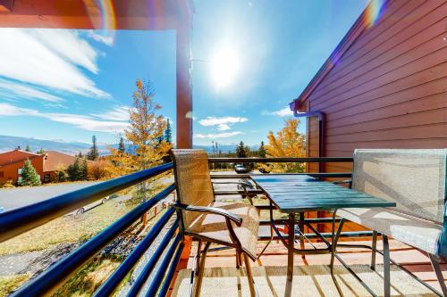 a table and chairs on the balcony of a house at Take the Mountain View in Silverthorne