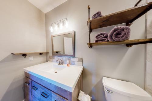 a bathroom with a sink and a toilet at Take the Mountain View in Silverthorne