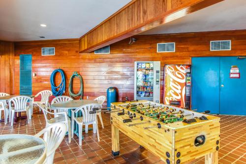 a game room with a foosball table and chairs at Take the Mountain View in Silverthorne