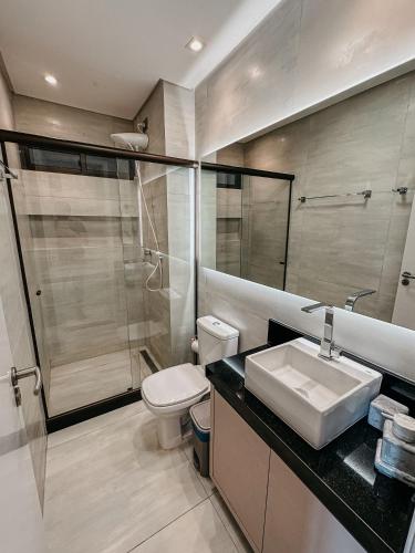 a bathroom with a toilet and a sink and a shower at Porto Atlantis by You In | 80m from Porto de Galinhas Beach in Porto De Galinhas