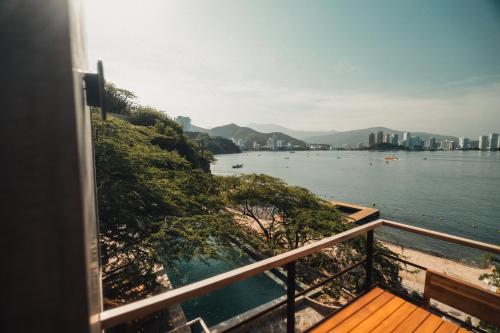 a view of the water from a balcony at Perla Roca Hotel Boutique - Beach Front in Santa Marta