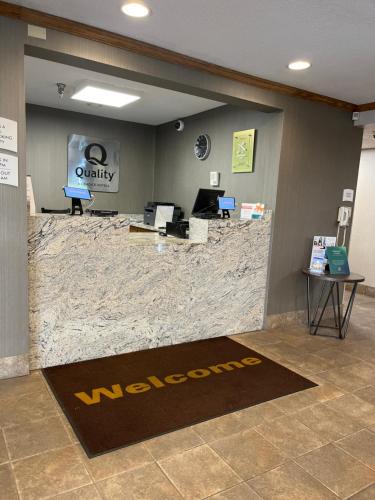 an office with a lobby with a maroon welcome rug at Quality Inn Arena in Wilkes-Barre