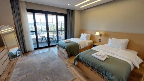 Ένα ή περισσότερα κρεβάτια σε δωμάτιο στο Mirage Taiaa Hotel Apartments