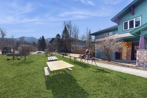 a group of benches sitting in the grass next to a building at Kestrels #18 in Morses Mill