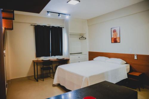 Katil atau katil-katil dalam bilik di Loft completo e climatizado a 2 minutos do centro