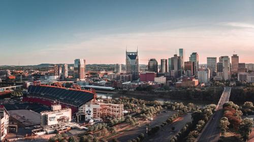 an aerial view of a city with a stadium at The Gilmore, an AvantStay Hotel in Nashville