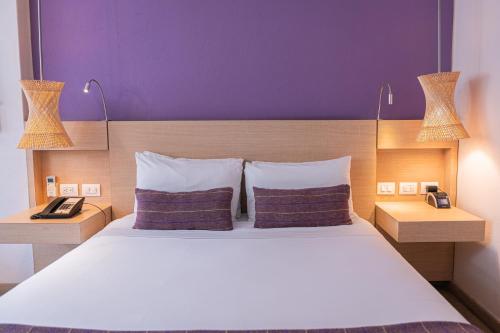 Postel nebo postele na pokoji v ubytování Hotel Bari Bucaramanga By OxoHotel