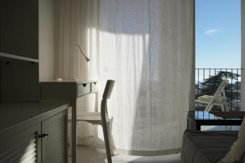 Quiet Studio in Fenals with Balcony, Pool and Workspace for Medium-Term Rental