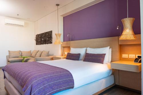 Postel nebo postele na pokoji v ubytování Hotel Bari Bucaramanga By OxoHotel