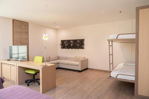 Postel nebo postele na pokoji v ubytování Hotel Bari Bucaramanga By OxoHotel