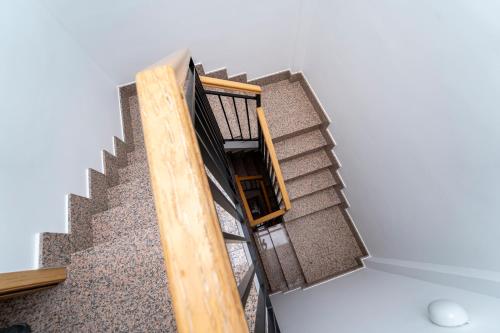 a rendering of a staircase in a house at Olmedo Hostal Plaza in Olmedo