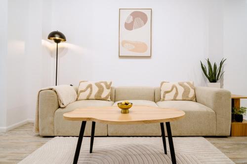 a living room with a couch and a coffee table at My Happy Place - Craiova in Craiova