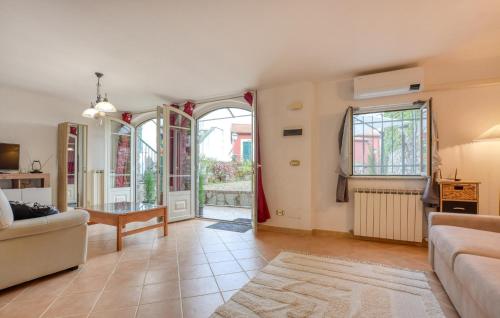 a living room with a couch and a table at 1 Bedroom Stunning Apartment In Masso in Castiglione Chiavarese
