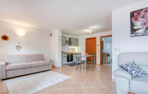 a living room with a couch and a table at 1 Bedroom Stunning Apartment In Masso in Castiglione Chiavarese