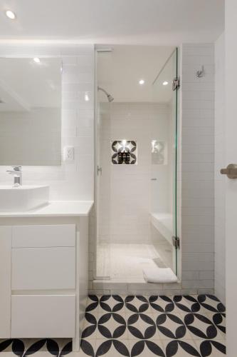 a bathroom with a shower and a sink at Nuevo Leon 155 by Wynwood House in Mexico City
