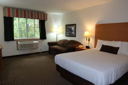 Ένα ή περισσότερα κρεβάτια σε δωμάτιο στο Americas Best Value Inn