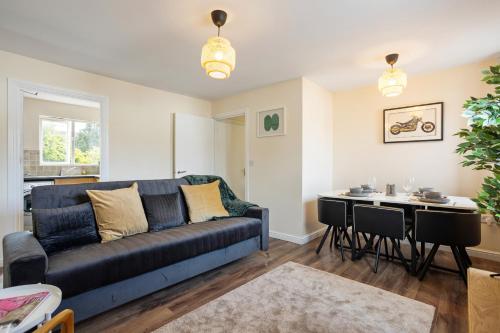 a living room with a couch and a table at 2-bed -Free parking- Excel - Canning Town- Canary Wharf in London