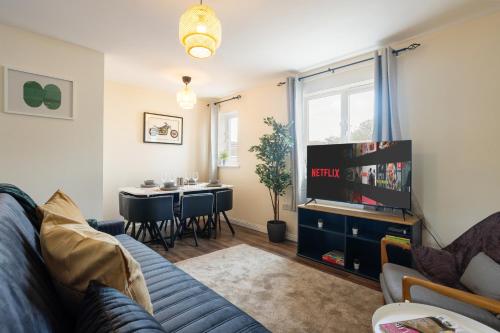 a living room with a couch and a table at 2-bed -Free parking- Excel - Canning Town- Canary Wharf in London