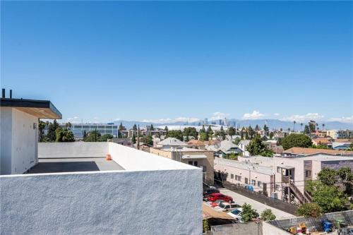 a view of the city from the roof of a building at Blue Central Stay Near USC, BMO Stadium & Downtown LA in Los Angeles