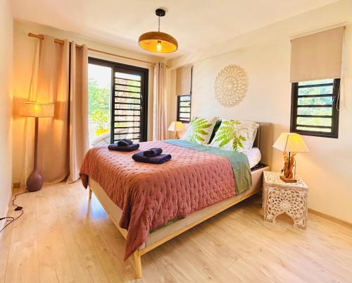 Voodi või voodid majutusasutuse Pacific Cosy Home Tiare, splendid view toas