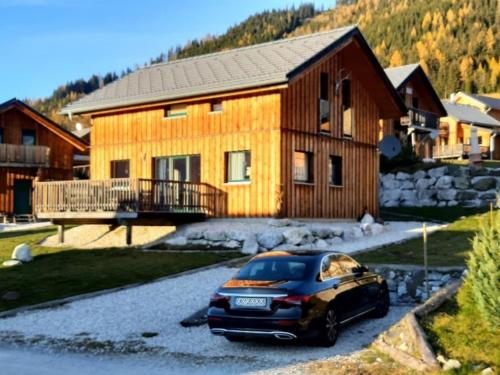 a car parked in front of a house at Bärenschanze in Hohentauern