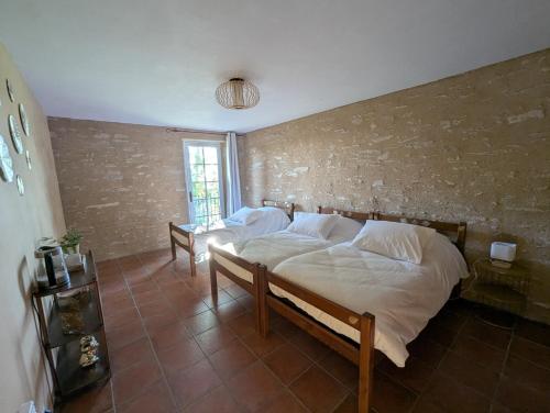 Ένα ή περισσότερα κρεβάτια σε δωμάτιο στο Saisonnée