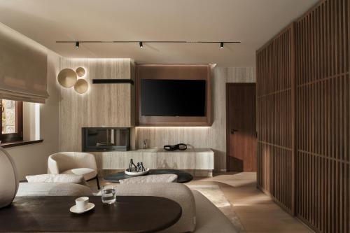 a living room with a couch and a table at Ceci Suites in Arachova