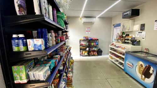 a aisle of a grocery store with food and drinks at Blue Life Torre 1 in Anápolis