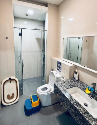 a bathroom with a shower and a toilet and a sink at Azure Residences, PJ Paradigm By Kiddie Space, Kids Friendly in Petaling Jaya