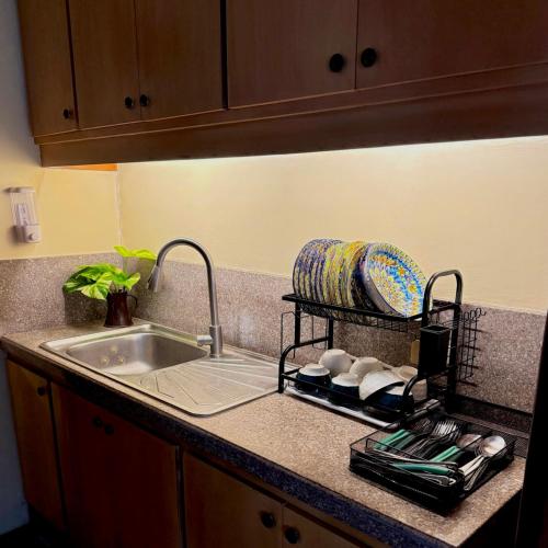 a kitchen counter top with a sink and a sink at Casa Valber - Home at Nasugbu in Utod