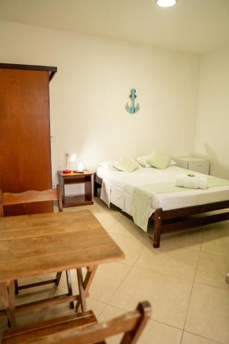 Postel nebo postele na pokoji v ubytování Pousada do Itaguá