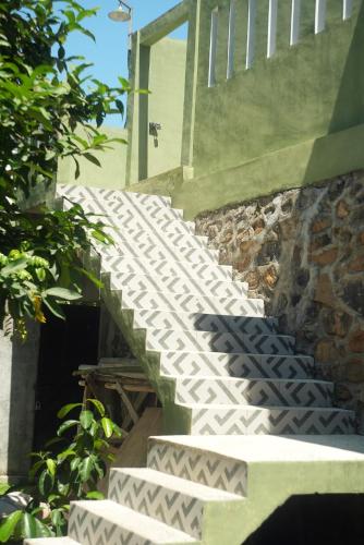 a set of stairs leading up to a building at NH Villa Lombok in Sangyang