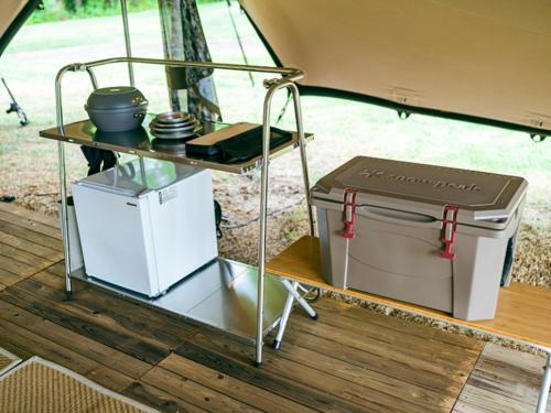 a table in the back of a camper with a food cart at SNOW PEAK FIELD SUITE SPA HEADQUARTERS in Morimachi