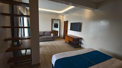 Ένα ή περισσότερα κρεβάτια σε δωμάτιο στο Akira Hotel