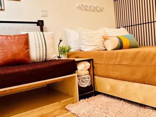 two beds sitting next to each other in a room at The Valley Hideout in Springville
