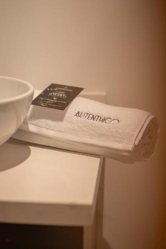 a towel sitting on a counter next to a sink at Autenthico Local Stay Hotel Envigado in Envigado