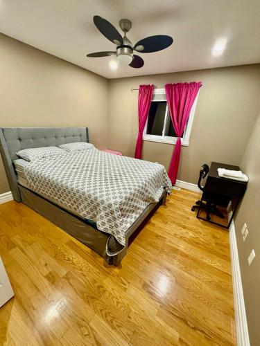 a bedroom with a bed and a ceiling fan at Windsor Home Room 3 in Windsor