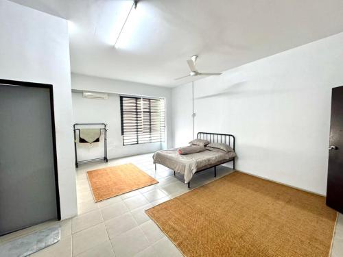 a bedroom with a bed and a window in it at Salak Lestari Homestay Klia Klia2 in Sepang