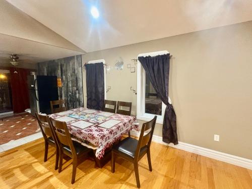 a dining room with a table and chairs at Windsor Home Room 3 in Windsor