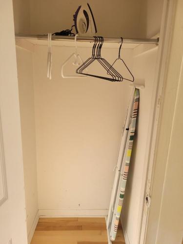 a room with a closet with a ladder and a shelf at Spacious and comfortable accommodation in Longueuil