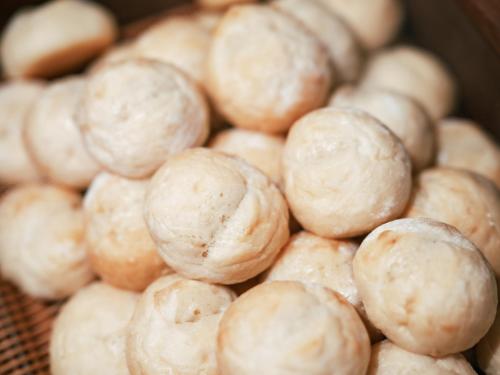 a pile of balls of food sitting on a table at Kinugawa Hotel Mikazuki in Nikko