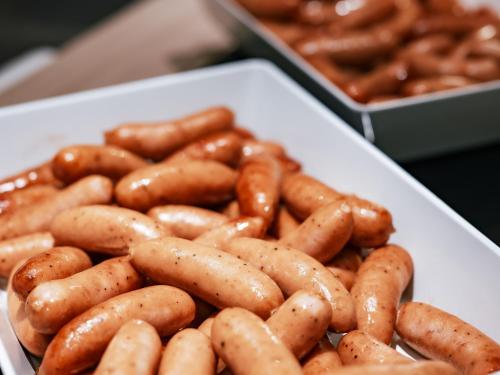 a white tray of hot dogs and sausages at Kinugawa Hotel Mikazuki in Nikko